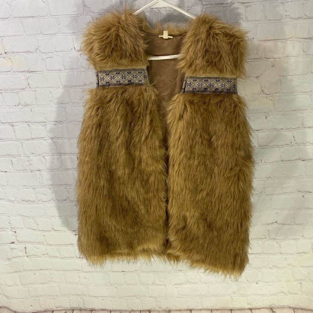 En Creme fur vest
